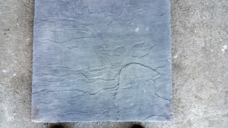 24x24x1 1/2 made of lightweight concrete. Modeled top very nice for any patio