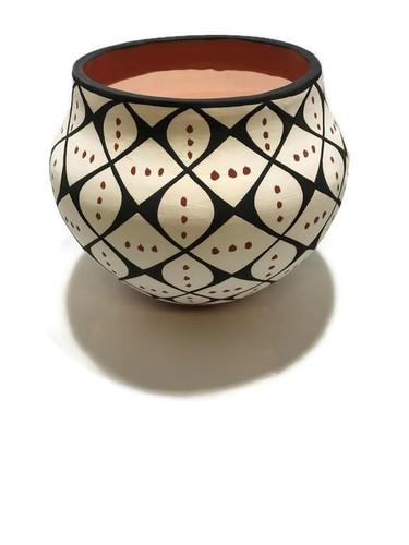 Mary Garcia Antonio is from the Acoma Pueblo Tribe and she creates traditional handcoiled pottery using the methods passed down to her by her ancestors.