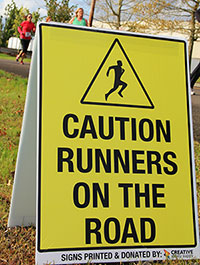 Caution Runners on the Road