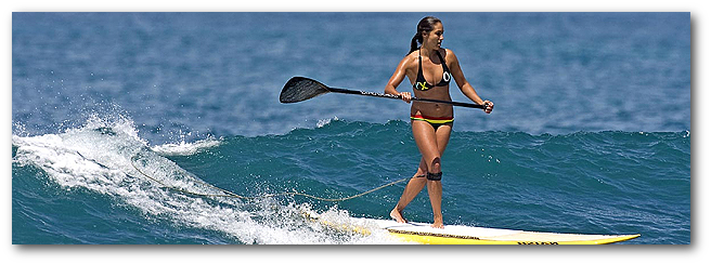 woman SUP surfing with paddleboard gear