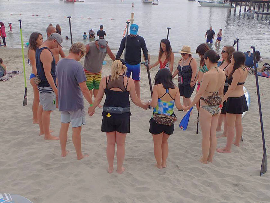 praying before community sup event