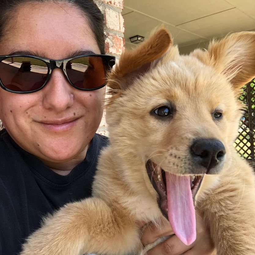 Erica with her dog Oso and outdoor TheraSpecs