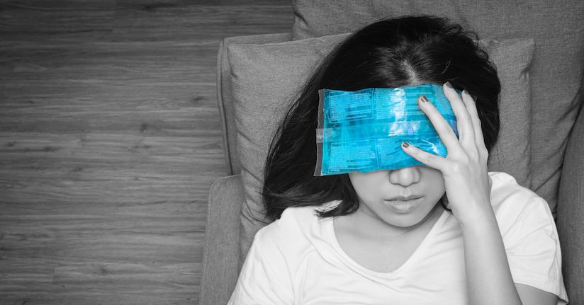 Woman with migraine, photophobia