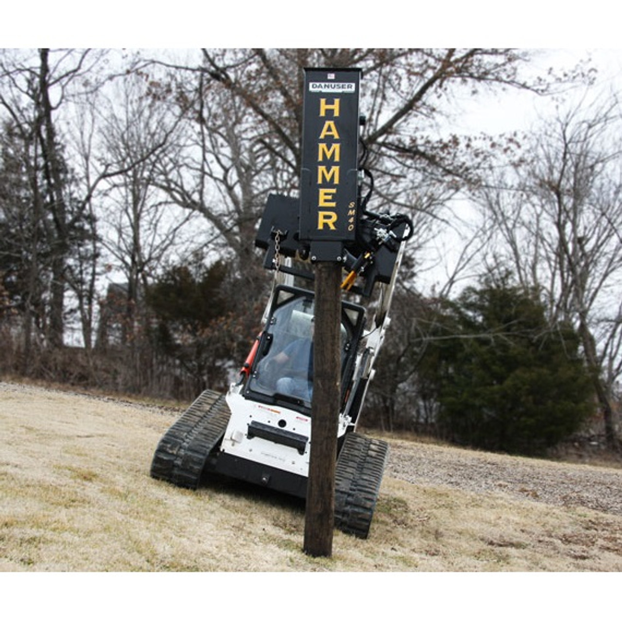 Skid Loader Attachment SM40 Tilt Post Pounder Holmes Rental Station