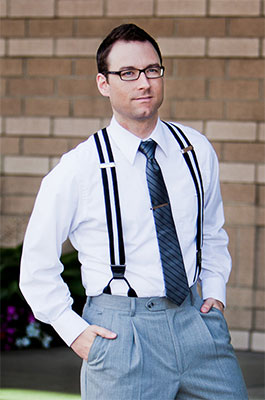Model wearing white and navy striped suspenders