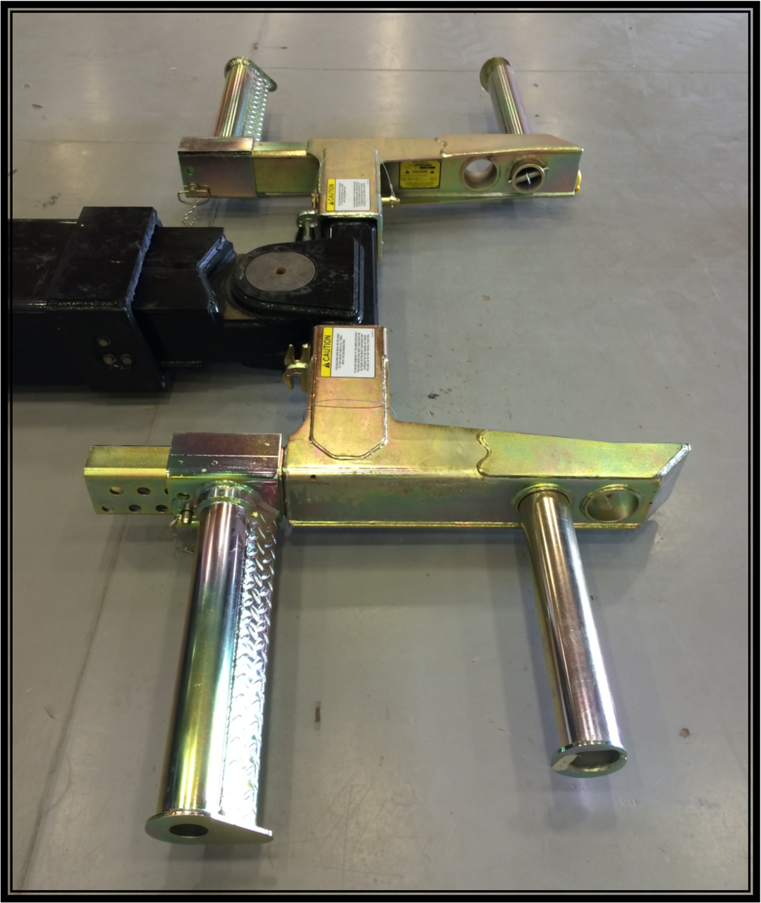 This product is a Jerr Dan Bus Arm, wheel grid, and tire lift installation