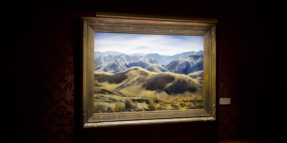 Mountain landscape painting with a Revelite Art Light in Social Club in Los Angeles