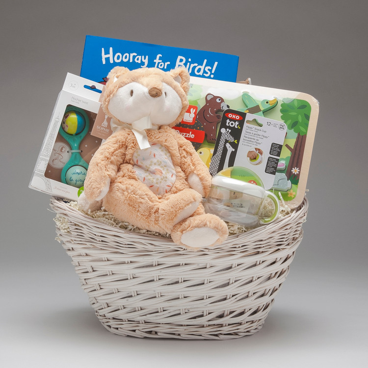 Ooooh do we ever LOVE this baby basket, with its shy Fox Plumpie by Douglas (which is under stuffed, extra squishy and overly loveable), and the gorgeous Lucy Cousins book "Hooray for Birds", this gift of Woodland Critters will be warmly welcomed! Gender neutral gift.