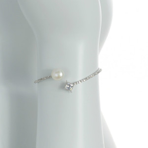 Crystal Coast - Pearl Bracelet zoom view: Mixed metal bangle bracelet set with CZs around one white freshwater pearl 10mm, and one large accent CZ, one size.
