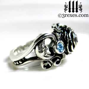 sterling silver moon ring, silver rose ring, silver flower ring, side view with moon detail and blue topaz stones december birthstone by 3 rexes jewelry